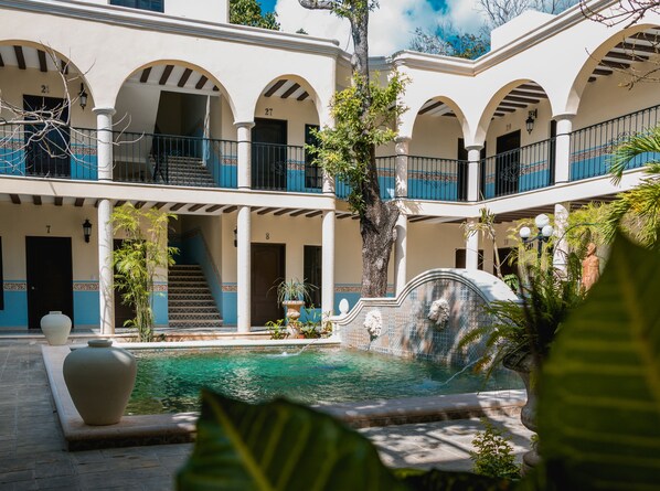 Outdoor pool, open 8:00 AM to 7:00 PM, pool loungers