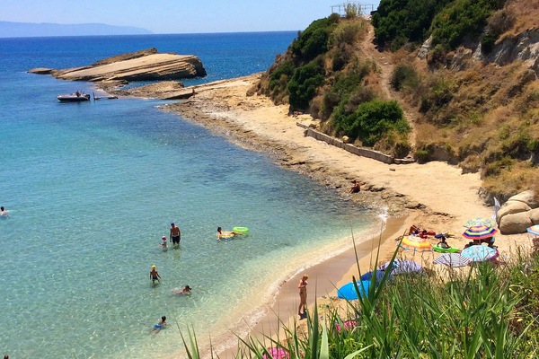 Sandy, cute Spartia beach: shallow, warm waters, few rocks around for snorkeling