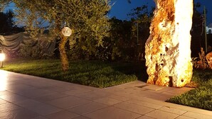 A stone sculpture in a garden at dusk. - magic and charm in a trullo  (Noci)