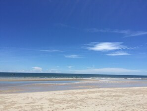 On the beach, sun loungers, beach towels