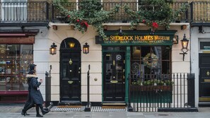 A building with a black door and a sign reading "Sherlock Holmes Museum". - Bikki Apartments, Bikki Apartments (Harrow)