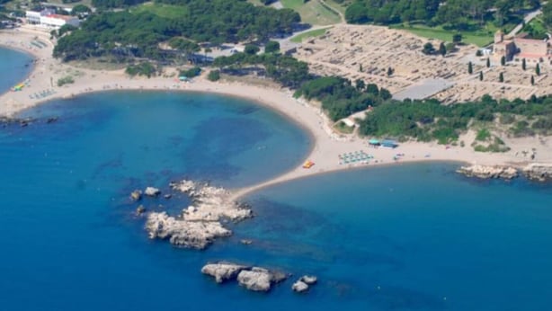 An aerial view of a coastal area with a beach, rocky outcrops, and a building complex. - House for 6 persons with private pool and large garden in L'Escala (L'Escala)
