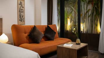 Deluxe Studio, 1 King Bed, Kitchenette, Courtyard View | Living area | 49-inch LCD TV with satellite channels, TV