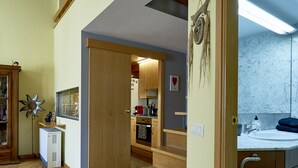 A spacious kitchen with wooden flooring, a built-in oven, and a marble backsplash. - Amazing duplex near the cathedral in the heart to Girona (Gerona)