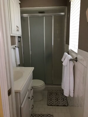 Combined shower/tub, hair dryer, towels, soap