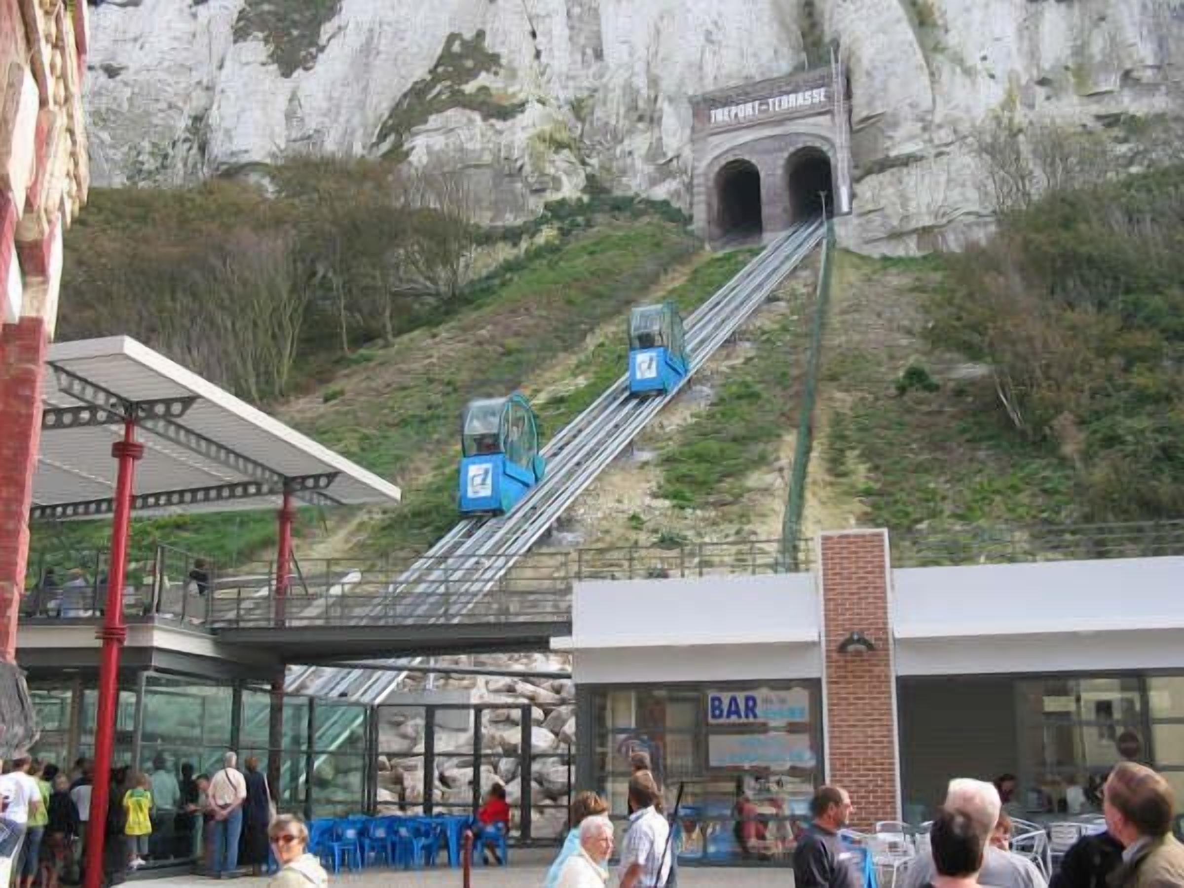 A cable car system with a bar and seating area below.