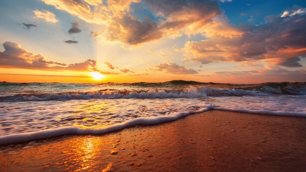 A beach with waves at sunset. - Beach Front on Galveston's West Beach (Galveston)