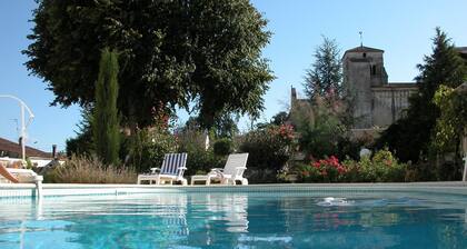 Character house, air-conditioned, heated pool, fenced garden with trees.