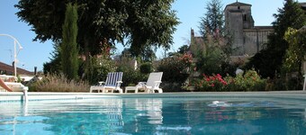 Character house, air-conditioned, heated pool, fenced garden with trees.