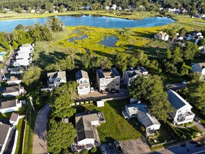 Surrounded by lush greenery and a serene body of water, this residential area offers a peaceful retreat.