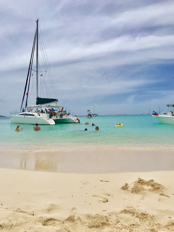 On the beach, sun loungers, beach towels