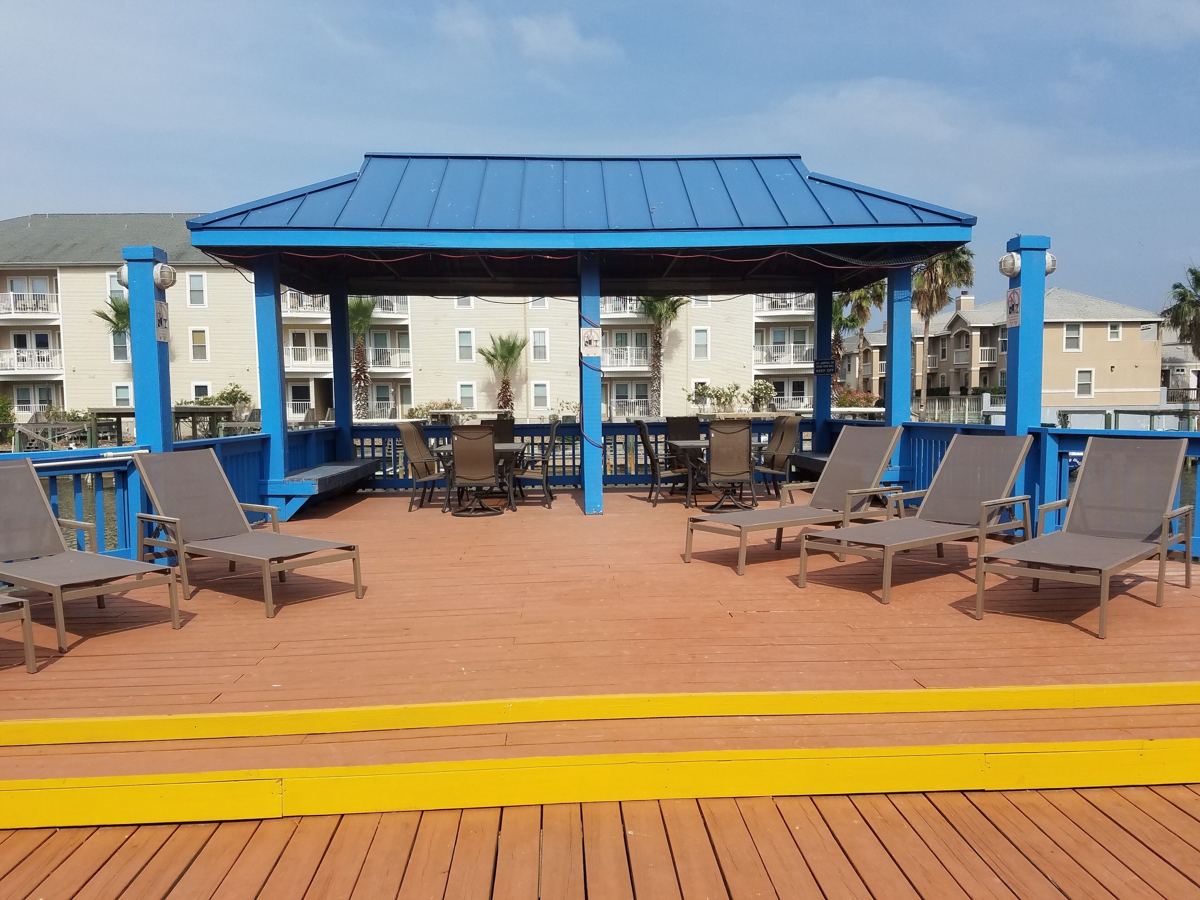 Large deck area next to pool overlooks the canal.