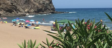 On the beach, sun-loungers