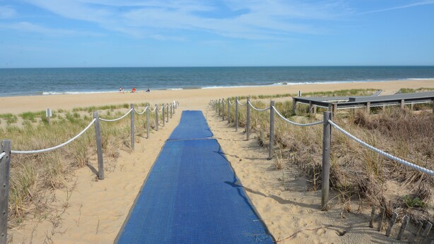 A beach pathway leading to the ocean with a wooden boardwalk and rope barrier. - Fenwick Island Home w/ Ocean Views Sleeps 11 (Fenwick Island)
