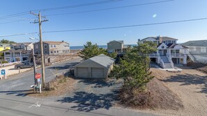 A coastal residential area with houses, a stop sign, and a garage. - Fenwick Island Home w/ Ocean Views Sleeps 11 (Fenwick Island)