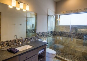 Shower, rainfall showerhead, hair dryer, towels