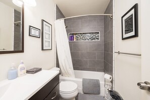 Combined shower/bathtub, hair dryer, towels, soap