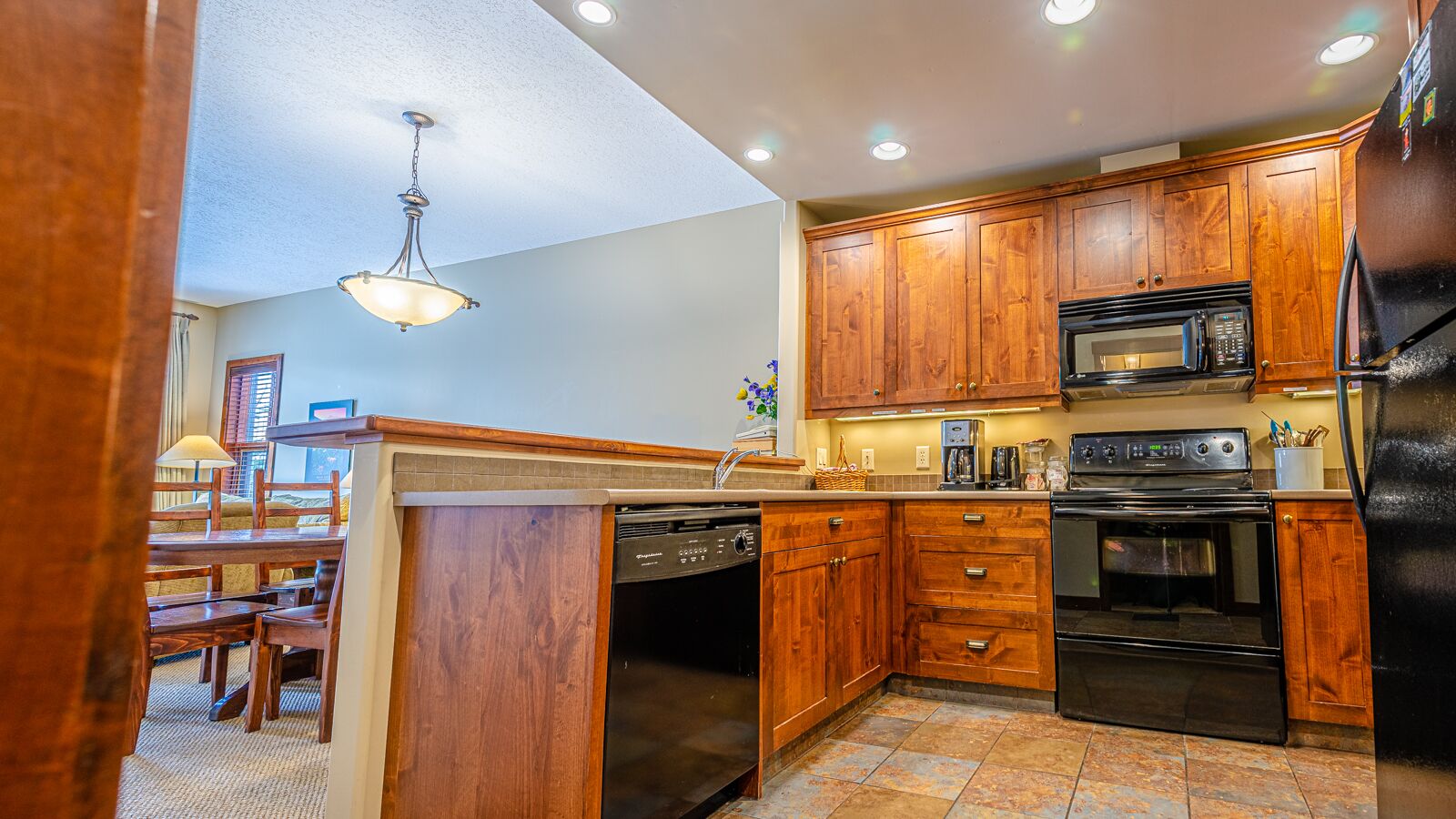 Excellent multi level 2 bedroom + den townhouse, close to Morrisey lift