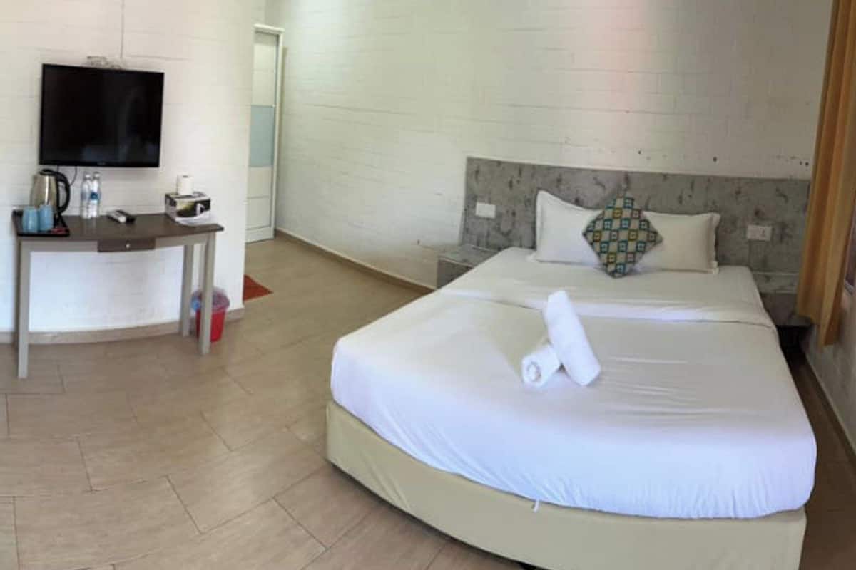 Deluxe Room, Pool View | In-room safe, desk, laptop workspace, iron/ironing board