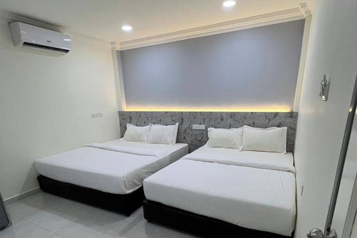 Family Room, Garden View | Minibar, in-room safe, desk, laptop workspace