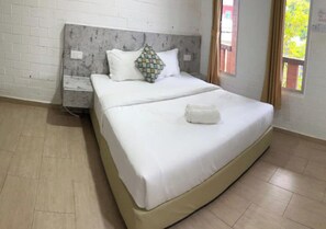 Deluxe Room, Pool View | Minibar, in-room safe, desk, laptop workspace - D'Lima Beach Inn (Langkawi)