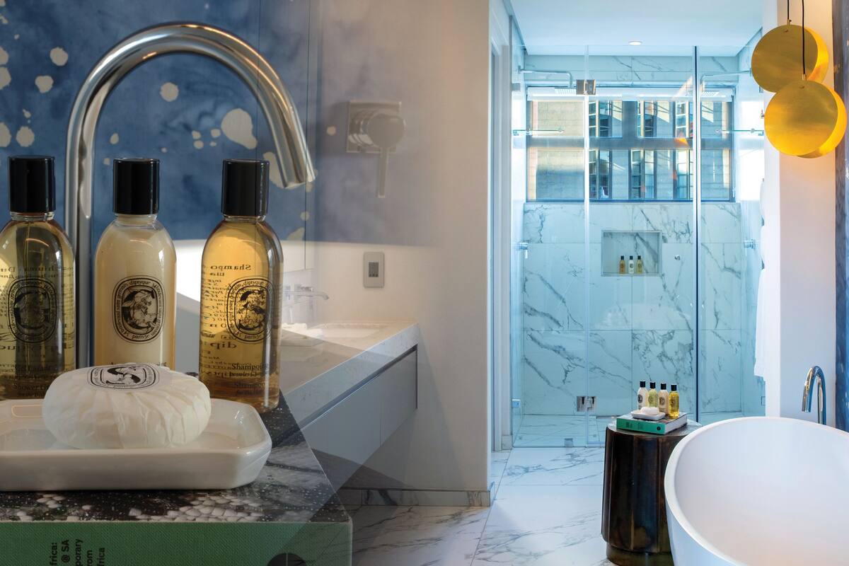 presidential suite | bathroom | designer toiletries, hair dryer, bathrobes, slippers