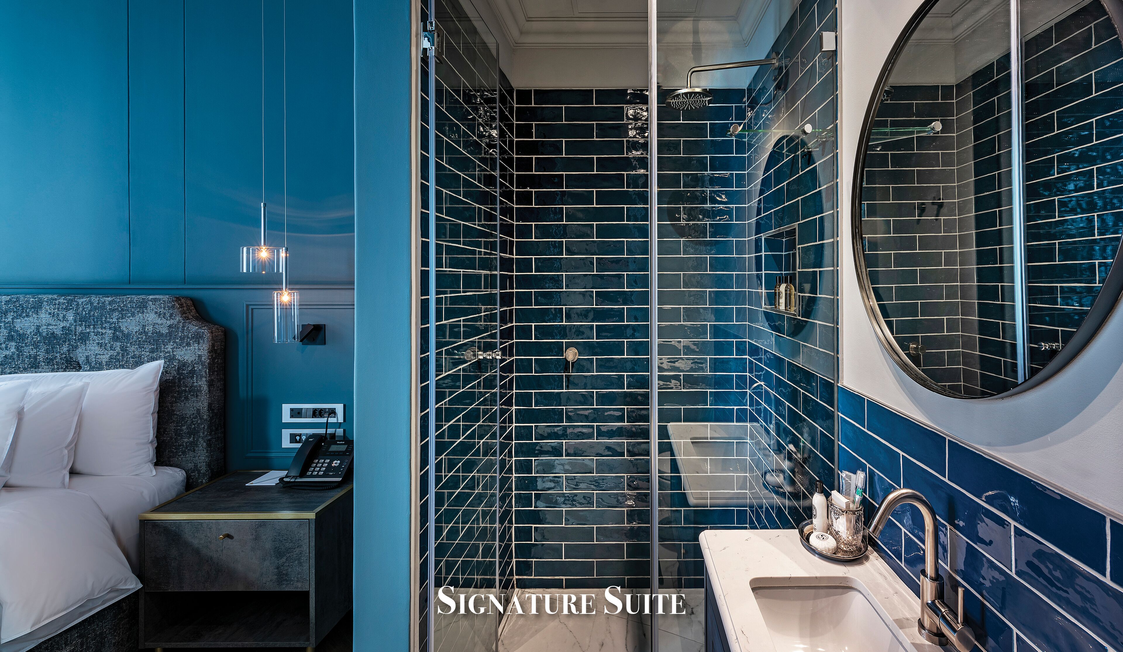 signature suite | bathroom | designer toiletries, hair dryer, bathrobes, slippers