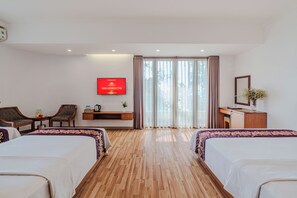 Habitación cuádruple familiar | Ropa de cama de alta calidad y minibar 