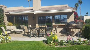 A house with a patio area featuring outdoor furniture and a grill. - Palm Valley with Beautiful View and Platinum Membership (Palm Desert)
