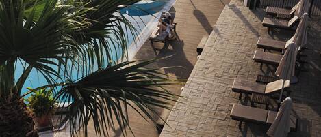 3 outdoor pools, open 9:00 AM to 7:00 PM, pool umbrellas, pool loungers