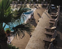 Outdoor pool, open 9:00 AM to 7:00 PM, pool umbrellas, sun loungers