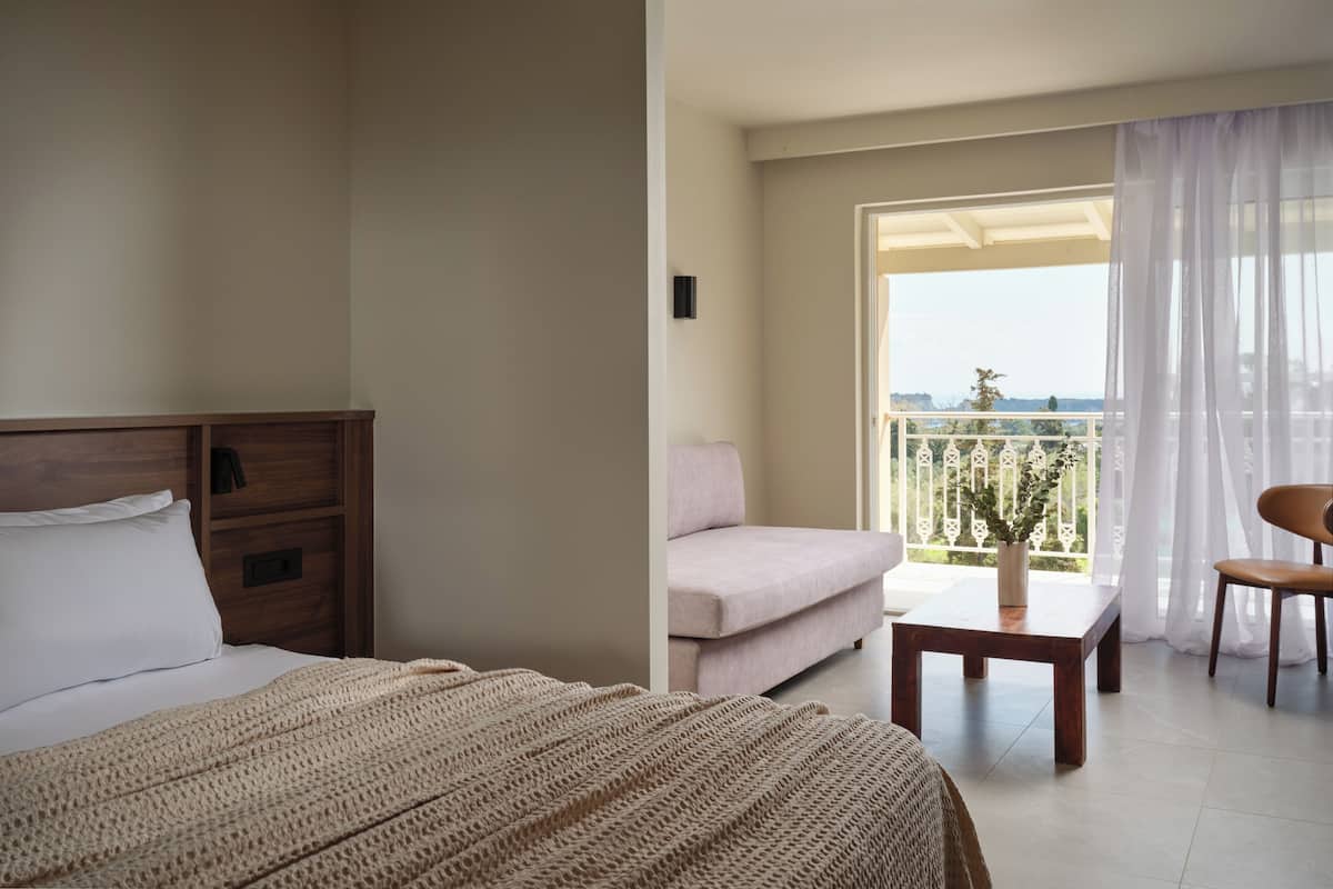 Serenity Suite with Sea View | Minibar, in-room safe, desk, iron/ironing board
