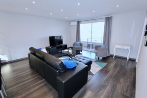 Penthouse | Living area | Flat-screen TV
