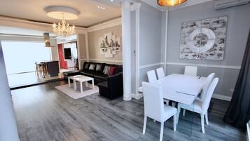 Deluxe Apartment | Living room | Flat-screen TV