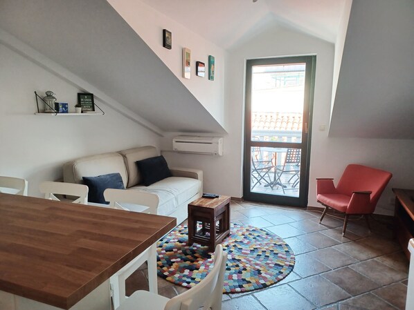 City Duplex, 1 Bedroom, Balcony | Living area | Flat-screen TV