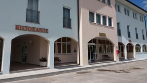 A building with a sign reading "RISTORANTE" indicating a restaurant. - RistHotel Airport (Fogliano Redipuglia)