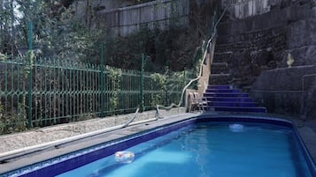 Outdoor pool, open 8:00 AM to 6:00 PM, free cabanas