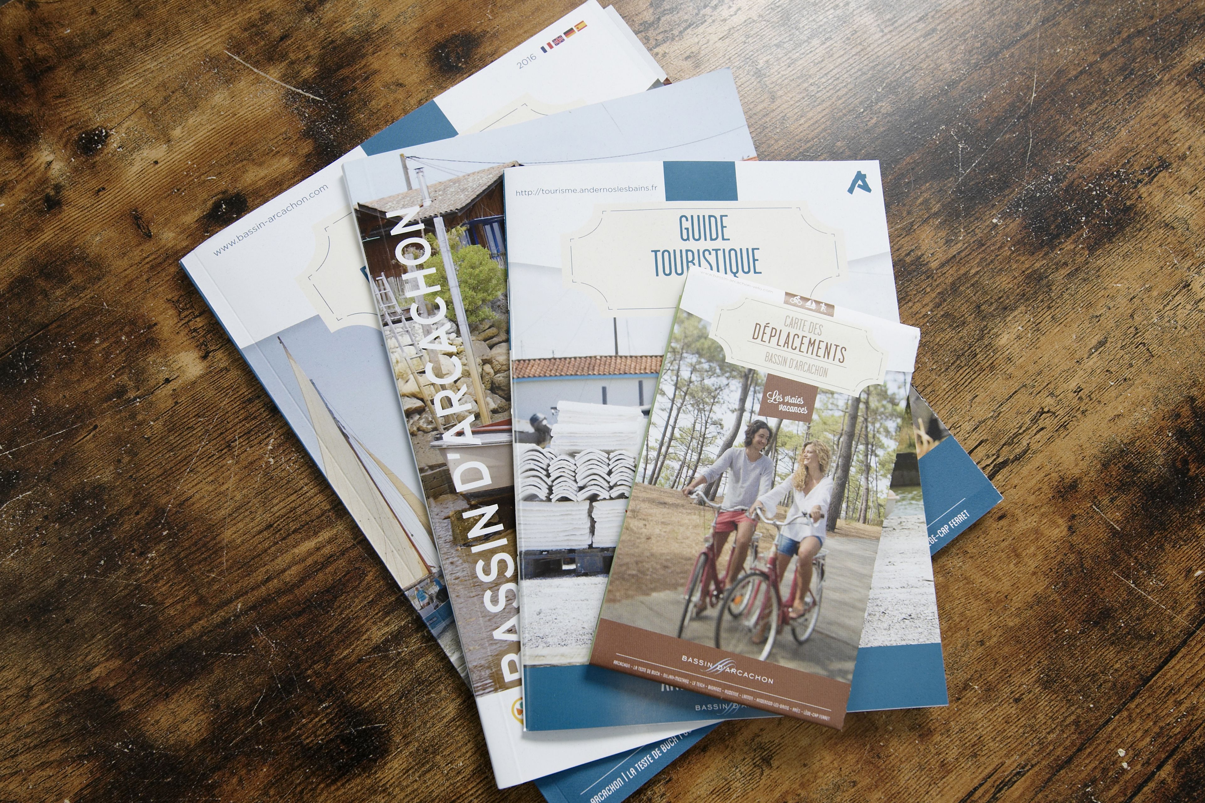 Brochures for a tourist guide and a website URL.