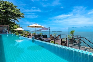 Outdoor pool, pool umbrellas, pool loungers