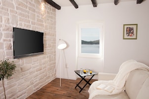 City Apartment, Sea View | 1 bedroom, desk, iron/ironing board, free cribs/infant beds