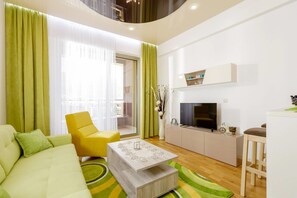 Appartement Confort | Coin séjour | Télévision LCD