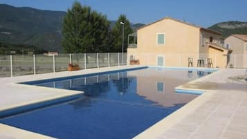 Seasonal outdoor pool, pool loungers