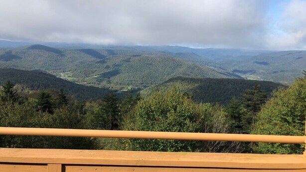 A panoramic view of a mountainous landscape with a wooden railing in the foreground. - Perfect For Large Families & Groups - Excellent Location (Snowshoe)