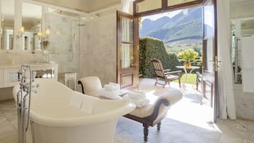 Superior Suite | Bathroom | Separate tub and shower, deep soaking tub, rainfall showerhead