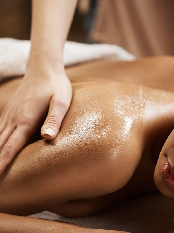 Experience rejuvenating massages and skincare treatments in a serene indoor setting.