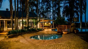 A resort with a pool, outdoor seating, and a covered area. - Loskop Valley Lodge and Restaurant (Groblersdal)