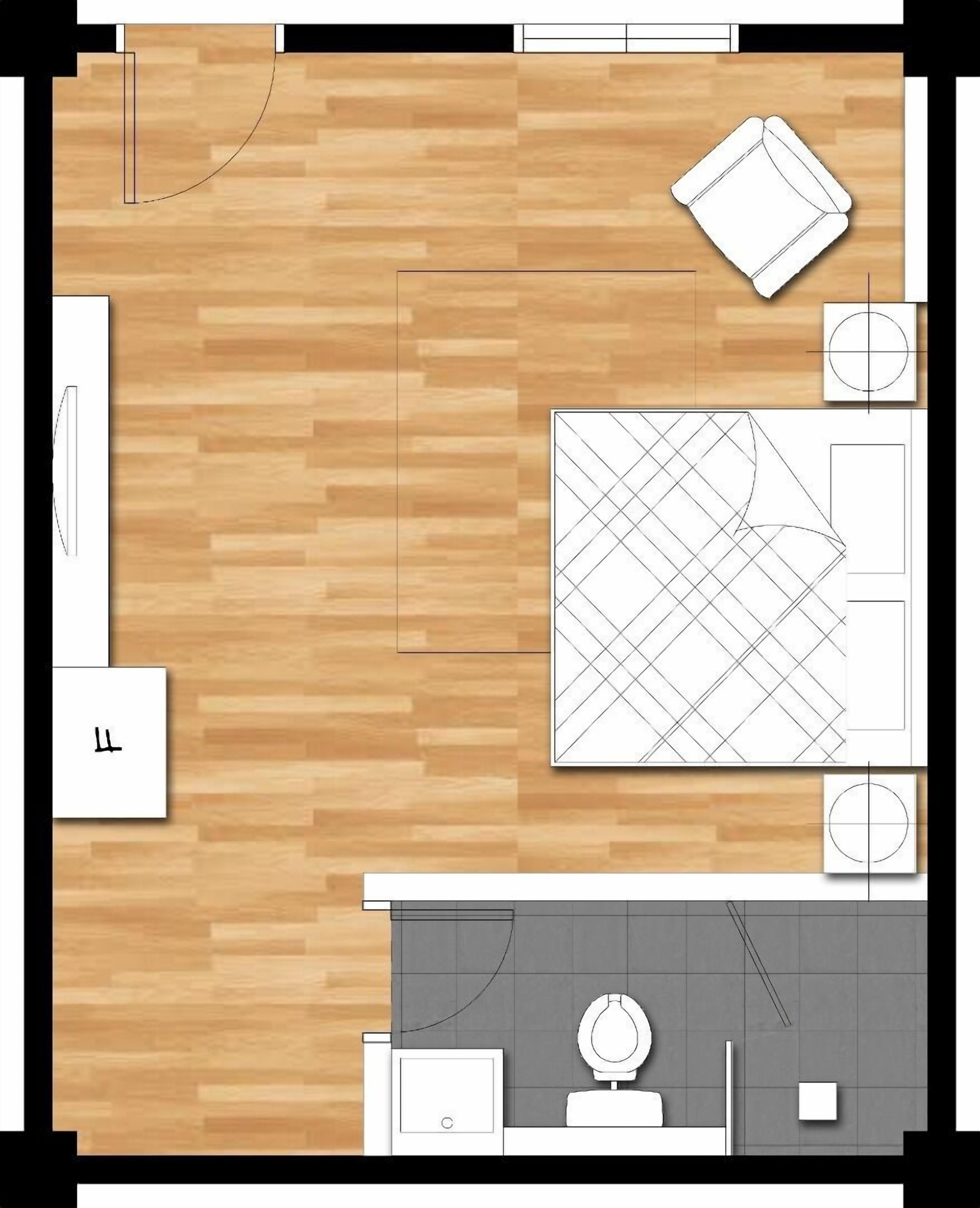 A floor plan of a hotel room with a bed, a desk, a chair, a small table, and a toilet.