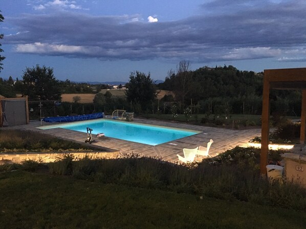 Seasonal outdoor pool, open 8:00 AM to 8:00 PM, pool umbrellas