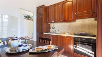 Exclusive Apartment, 1 Bedroom, Kitchen, Sea View | Private kitchen | Fridge, microwave, oven, stovetop
