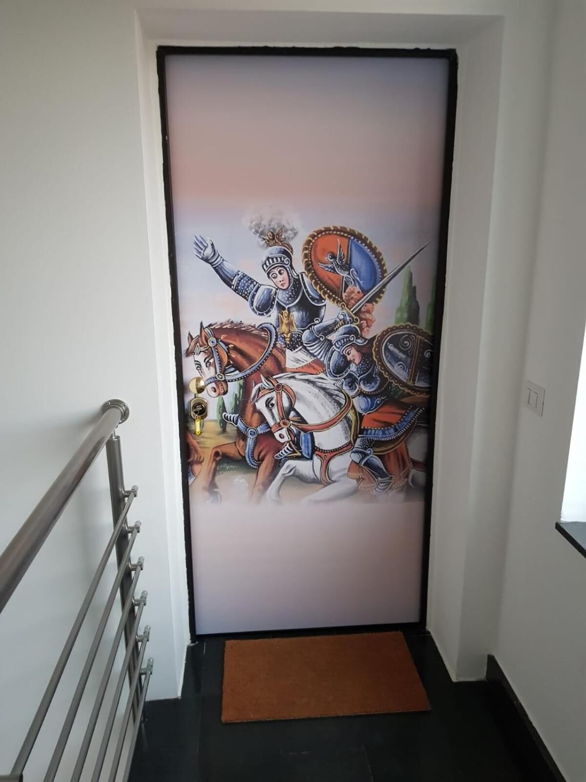 A hallway with a large, colorful mural of a knight on horseback.